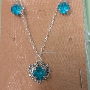 Handmade Swarovski crystal jewelry necklace and earring set in a teal blue color